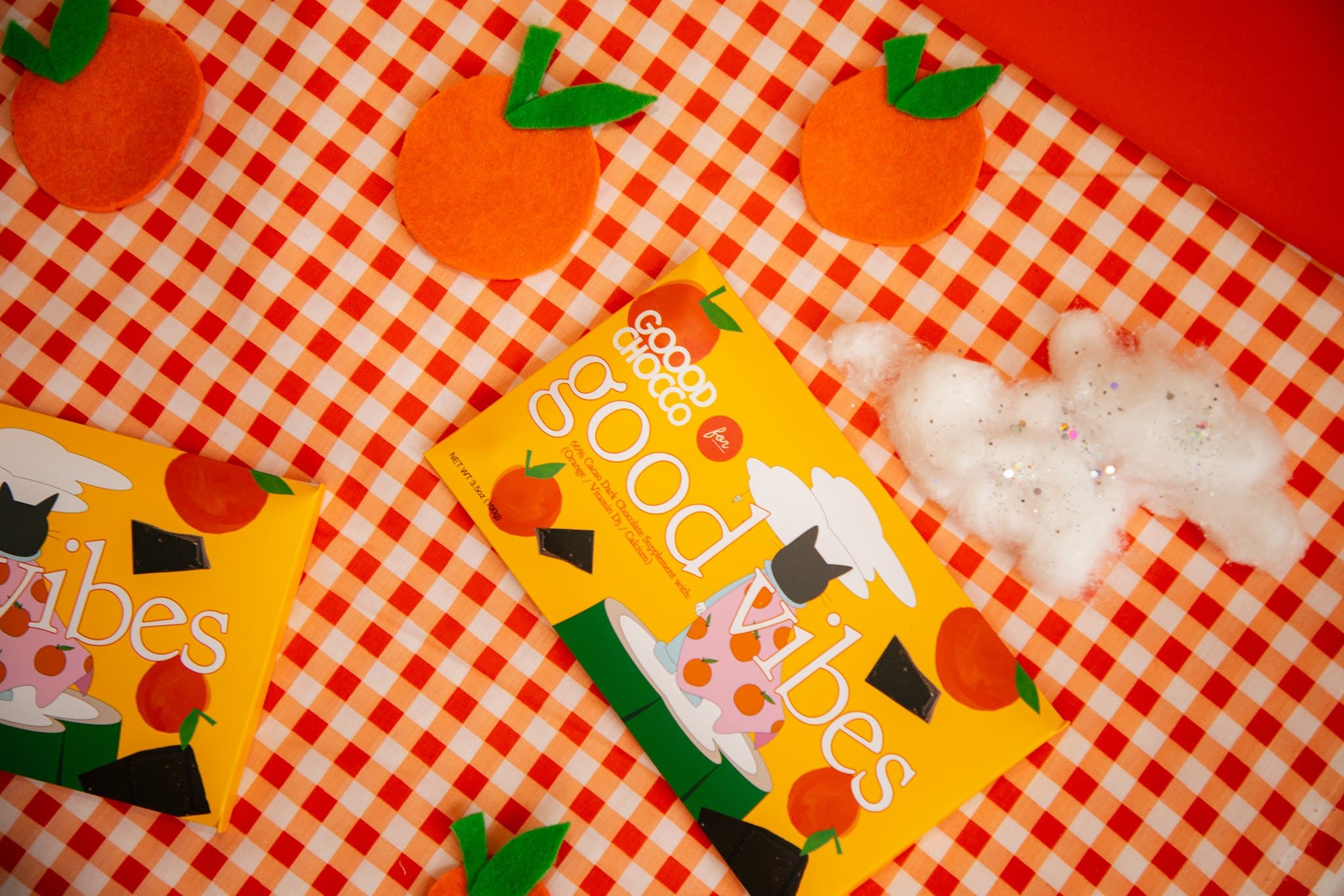 Good Vibes bars on a gingham picnic blanket